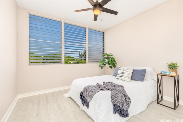 bedroom featuring light hardwood / wood-style flooring and ceiling fan