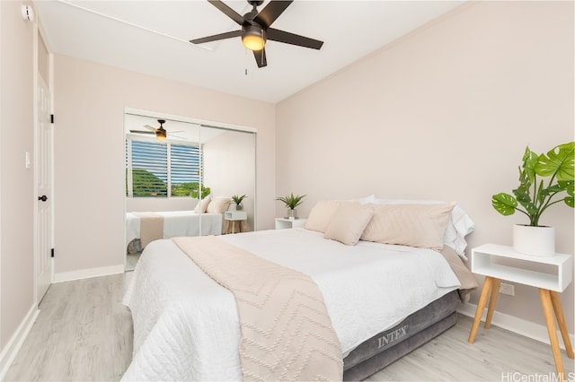 bedroom featuring a closet, light wood-type flooring, and ceiling fan