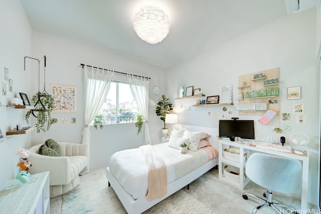 bedroom featuring light carpet