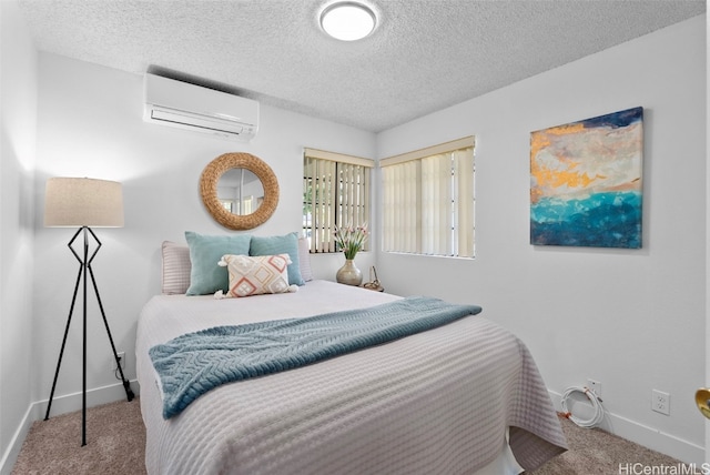 bedroom with carpet flooring, a wall mounted AC, and a textured ceiling