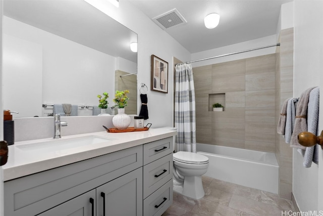 full bathroom with vanity, shower / tub combo with curtain, and toilet