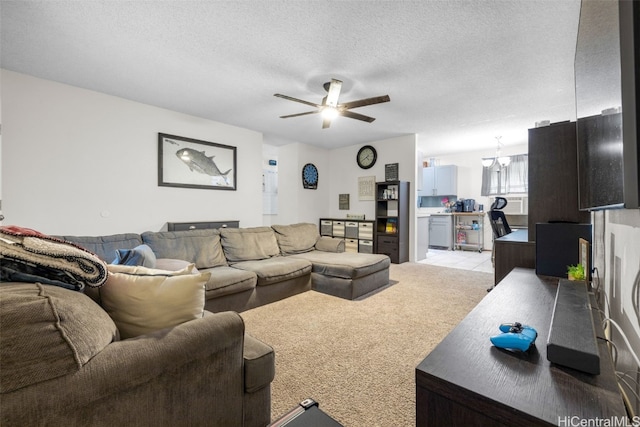 carpeted living room featuring ceiling fan and a textured ceiling