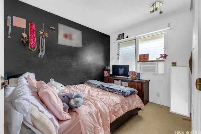 carpeted bedroom featuring cooling unit and a textured ceiling