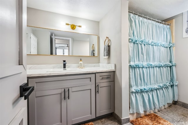 bathroom featuring vanity and a textured ceiling