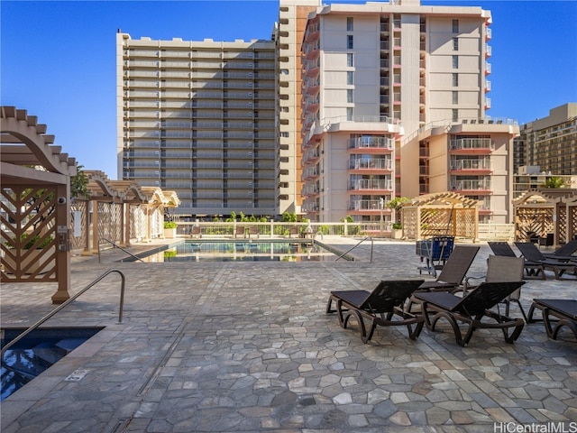 view of patio / terrace featuring a community pool