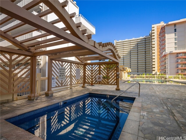 view of swimming pool featuring a patio area