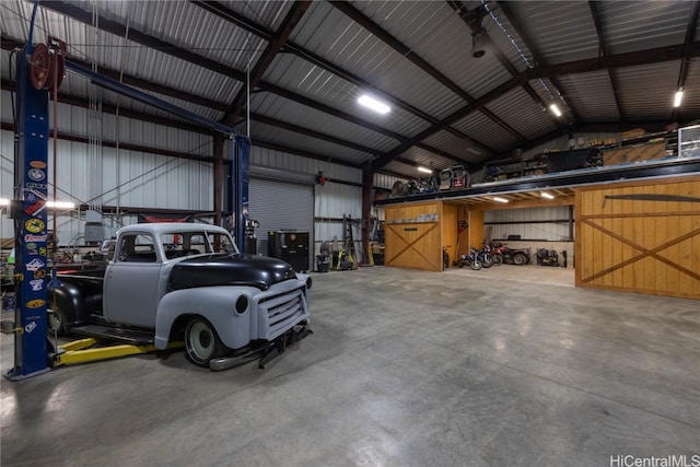 garage featuring wooden walls