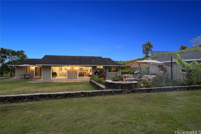 back of house featuring a yard and a patio area