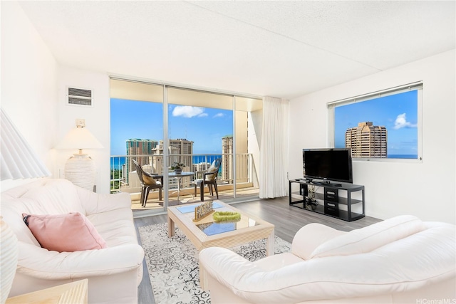 400 Hobron Ln Unit 3101, Honolulu, HI 96815 - living room with a wall of windows and wood finished floors
