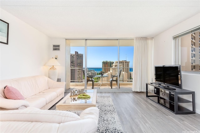 400 Hobron Ln Unit 3101, Honolulu, HI 96815 - living area featuring wood finished floors and floor to ceiling windows