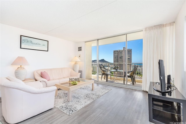 400 Hobron Ln Unit 3101, Honolulu, HI 96815 - living room with wood finished floors and floor to ceiling windows