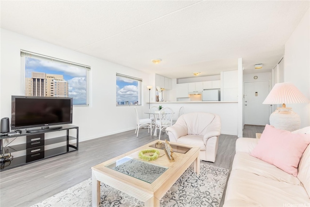 400 Hobron Ln Unit 3101, Honolulu, HI 96815 - living area featuring light wood-style floors and baseboards