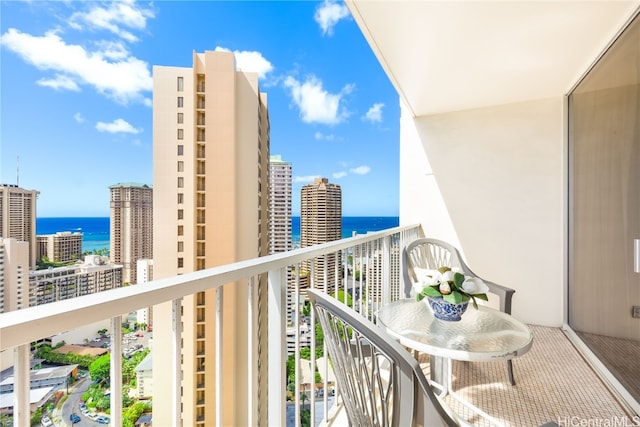 balcony featuring a water view