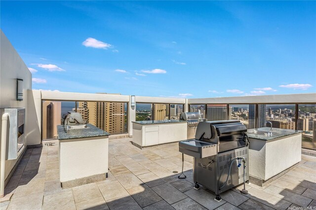 400 Hobron Ln Unit 3101, Honolulu, HI 96815 - view of patio / terrace featuring an outdoor kitchen, a sink, and grilling area