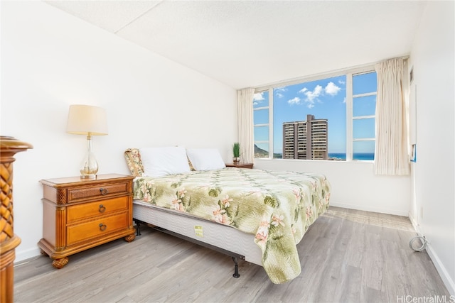 bedroom with light wood-type flooring