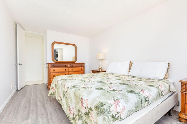 400 Hobron Ln Unit 3101, Honolulu, HI 96815 - bedroom with light wood-type flooring and baseboards