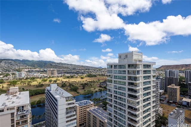 exterior space featuring a water and mountain view