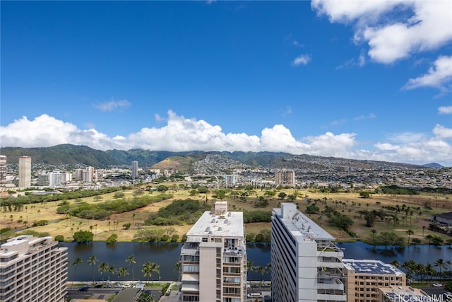 birds eye view of property with a water and mountain view