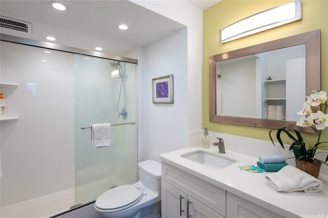 bathroom featuring vanity, visible vents, toilet, recessed lighting, and a shower stall