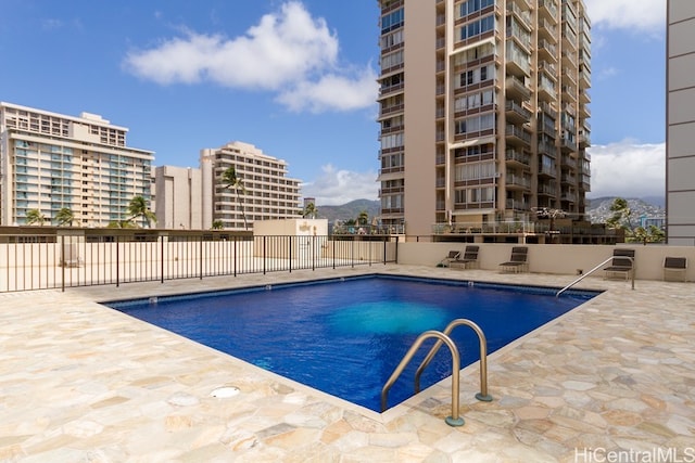 view of swimming pool featuring a patio