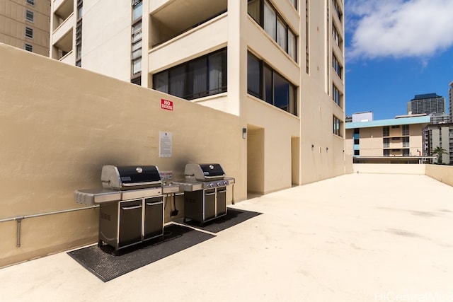 exterior space with a grill