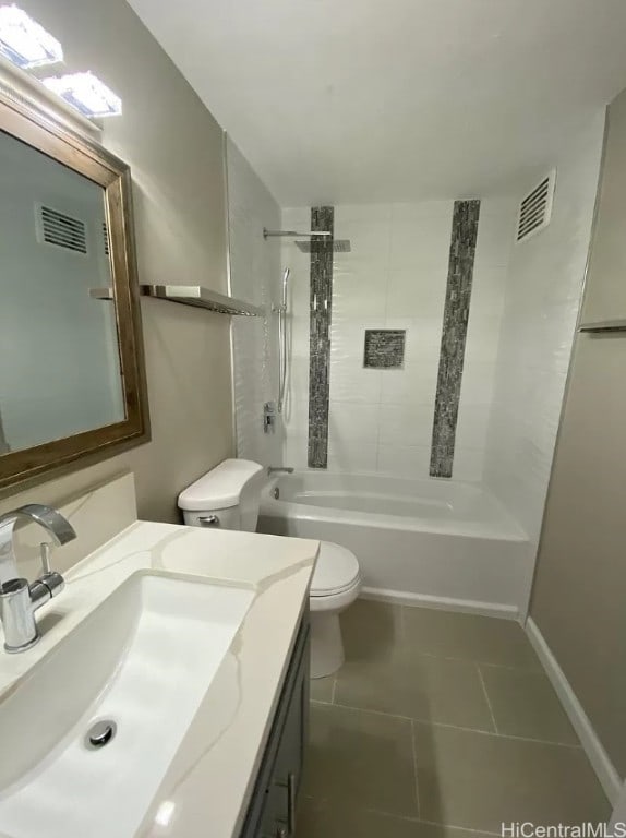 full bathroom with toilet, vanity, tiled shower / bath, and tile patterned flooring