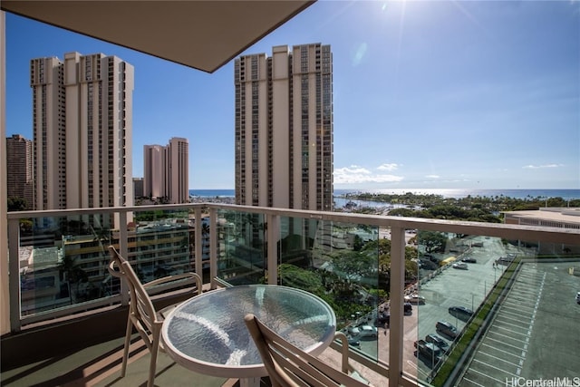 balcony featuring a water view