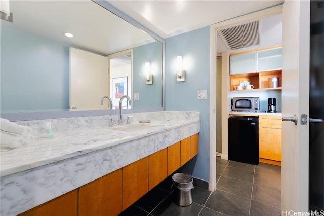 bathroom with tile patterned floors and sink