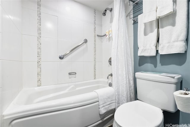 bathroom with shower / bath combo with shower curtain and toilet