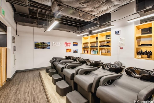 home theater room featuring wood-type flooring