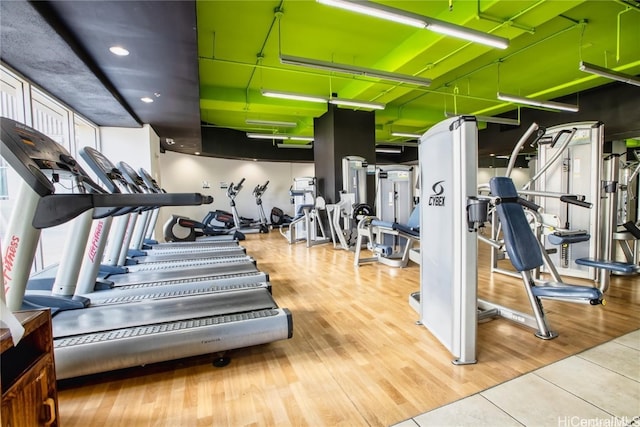 workout area with light wood-type flooring