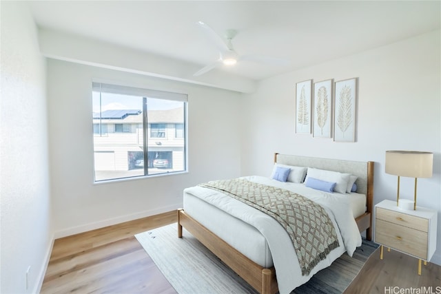 bedroom featuring hardwood / wood-style floors and ceiling fan