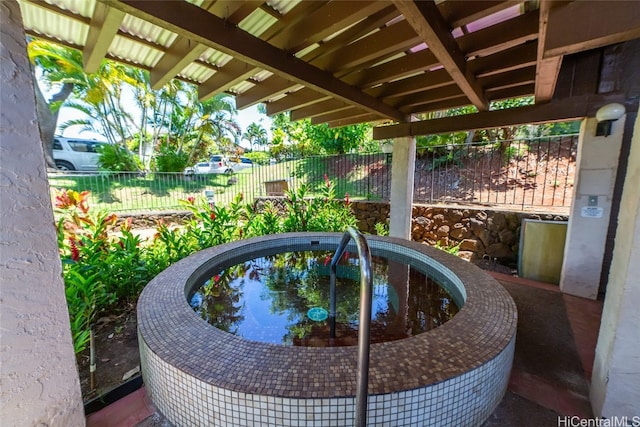 view of pool with a jacuzzi