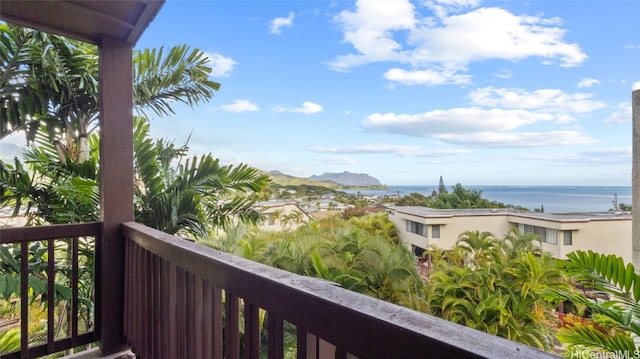 balcony featuring a water view