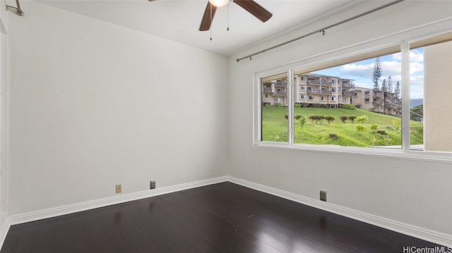 unfurnished room featuring hardwood / wood-style flooring and ceiling fan