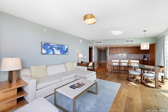 living room featuring light wood-type flooring