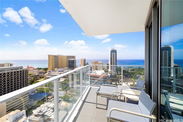 balcony featuring a water view