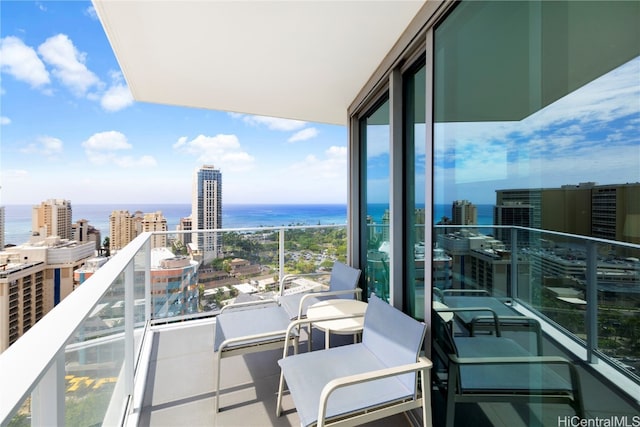 balcony featuring a water view