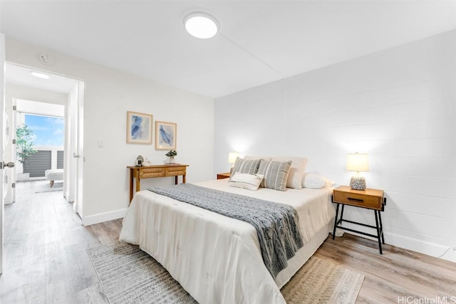 bedroom with light hardwood / wood-style floors