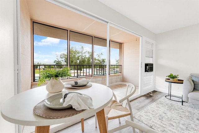 68-90 Au St Unit E511, Waialua, HI 96791 - dining area featuring healthy amount of natural light, wood finished floors, and baseboards
