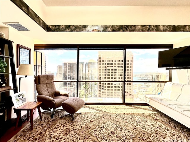 living room with hardwood / wood-style flooring and a healthy amount of sunlight