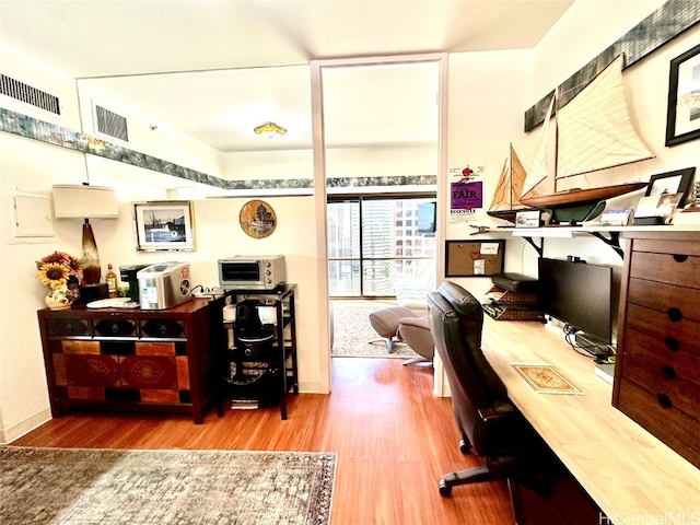 office area with hardwood / wood-style flooring