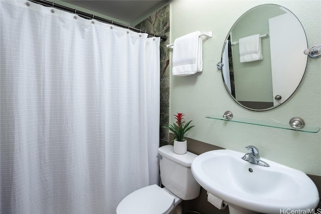 bathroom featuring sink and toilet