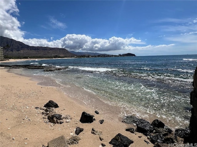 property view of water with a mountain view and a view of the beach