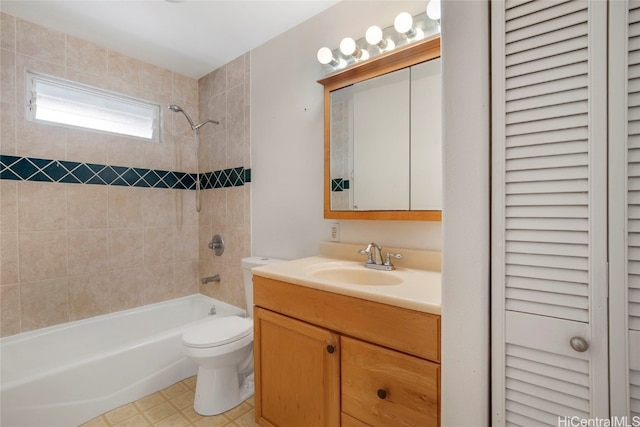 full bathroom with vanity, toilet, and tiled shower / bath