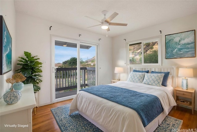 bedroom with access to outside, ceiling fan, and hardwood / wood-style floors