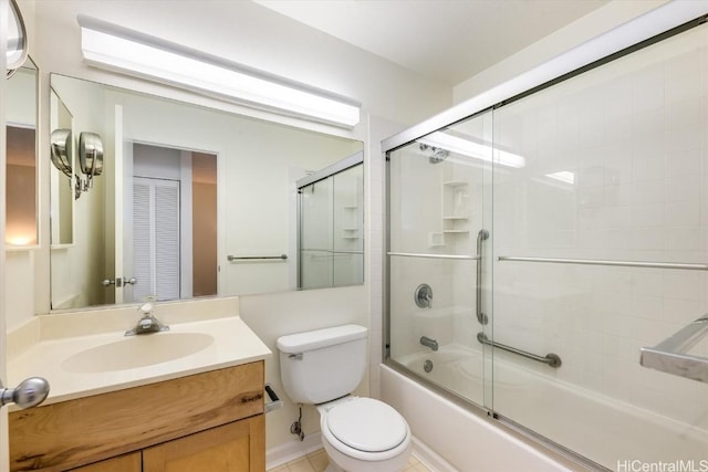 full bathroom with toilet, vanity, and combined bath / shower with glass door