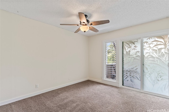 carpeted empty room with a textured ceiling and ceiling fan