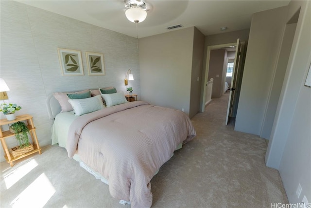 carpeted bedroom featuring ceiling fan