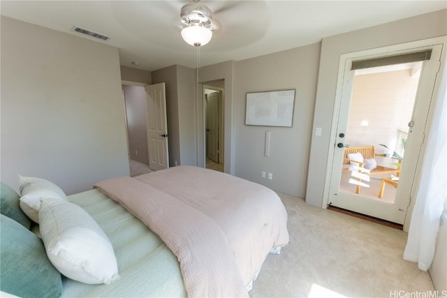 bedroom with ceiling fan and light carpet